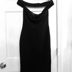 Knee length form fitting black dress